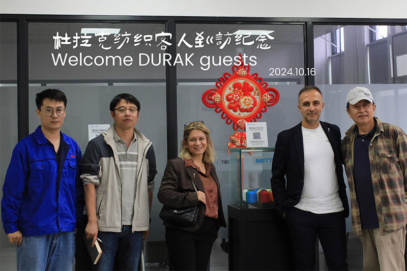 Suzhou Nett New Material Technology Co., Ltd. wita tureckiego klienta Durak Tekstil na wizytę strategiczną